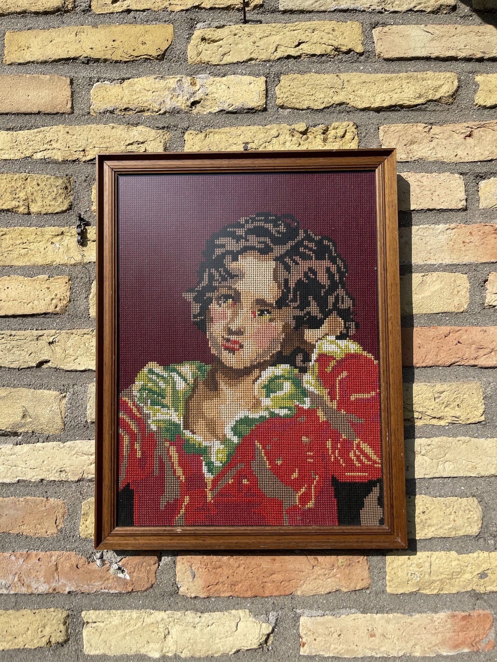 Boorduurwerk ‘the red boy’ ingelijst